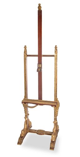 A CARVED WOOD AND GILT ARTIST