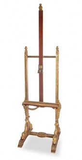 A CARVED WOOD AND GILT ARTIST