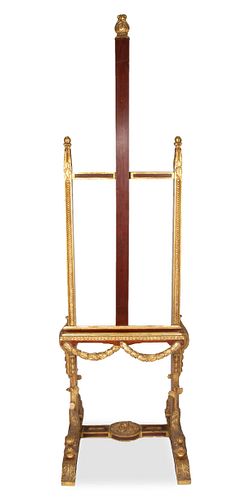 A CARVED WOOD AND GILT ARTIST