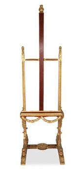 A CARVED WOOD AND GILT ARTIST