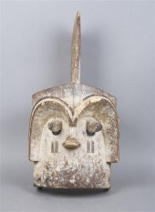 A Carved Wood and Painted Mbot
