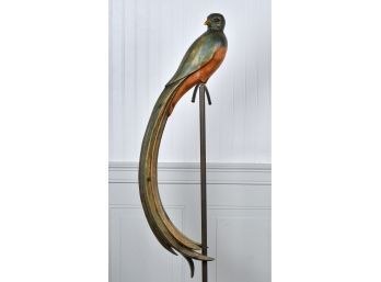 A carved wood and painted parrot