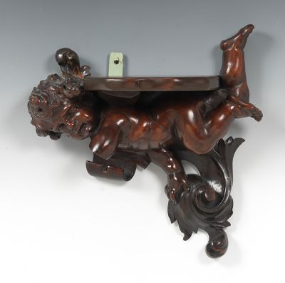 A Carved Wood Cherub Wall Shelf