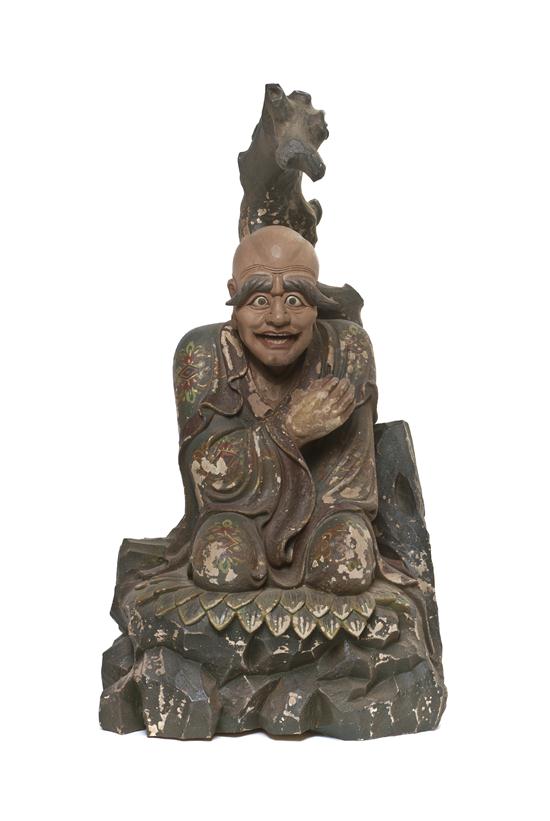 A Carved Wood Figure depicting a