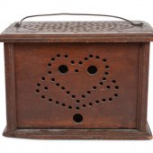 A Carved Wood Footwarmer
Late