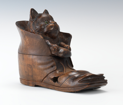 A Carved Wood Kitten In a Shoe