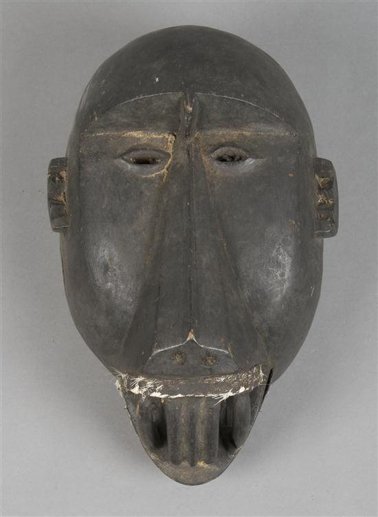 A Carved Wood Mask West African