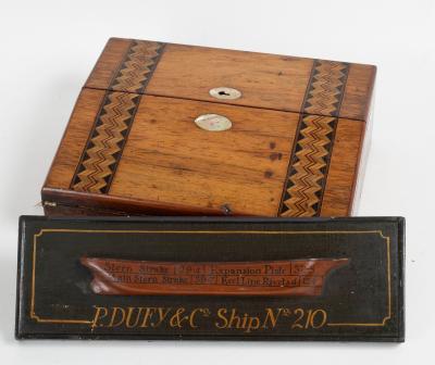 A carved wood mounted hull by P