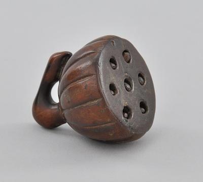 A Carved Wood Pod Shape Netsuke