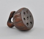 A Carved Wood Pod Shape Netsuk