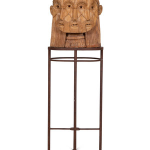 A Carved Wood Sculpture of a