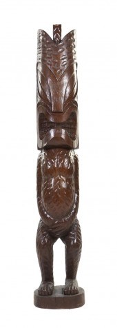 A Carved Wood Tiki depicted up