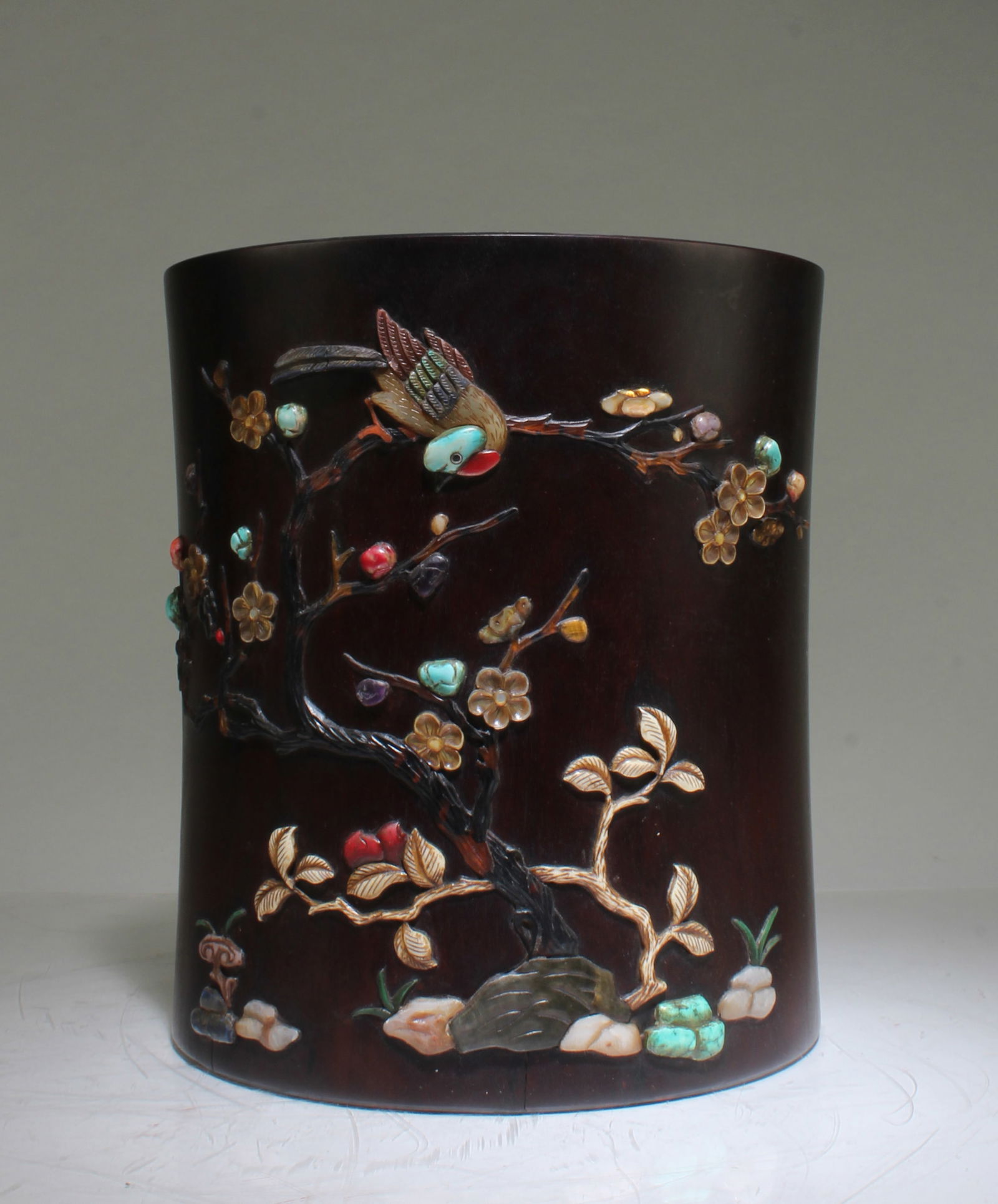 A CARVED WOODEN BRUSHPOTA Carved