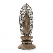 A CARVED WOODEN SCULPTURE OF T