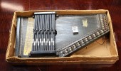 A CASED AUTOHARP A cased autoh