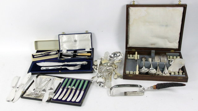 A cased pair of plated fish servers