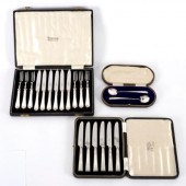A cased set of silver handled