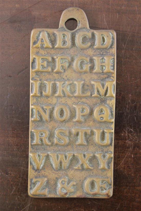 A cast brass alphabet plaque the