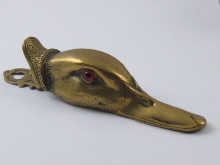 A cast brass duck's head paper clip