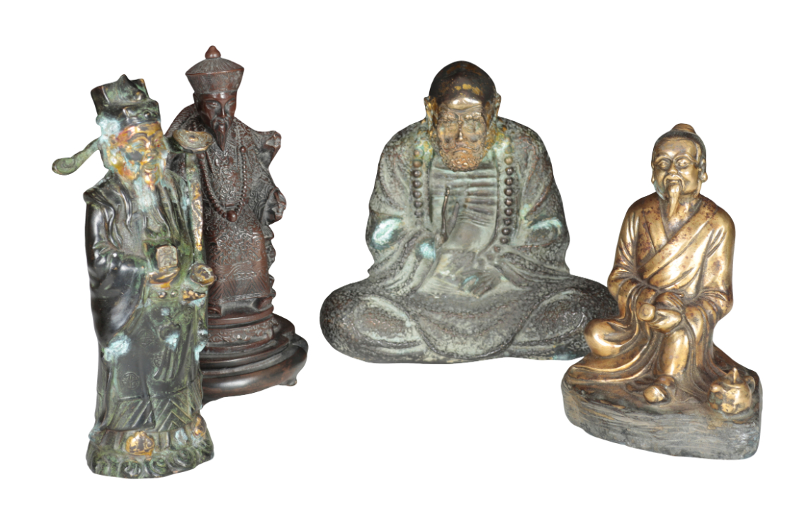 A CAST BRONZE FIGURE OF A SEATED
