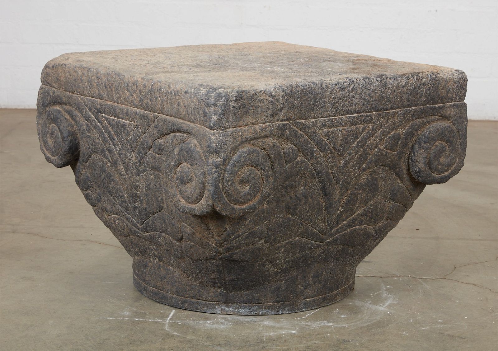 A CAST COMPOSITION FAUX STONE