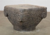 A CAST COMPOSITION FAUX STONE
