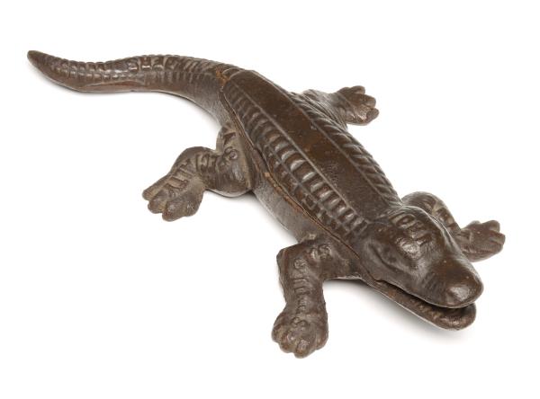 A CAST IRON ALLIGATOR STOVE TOP