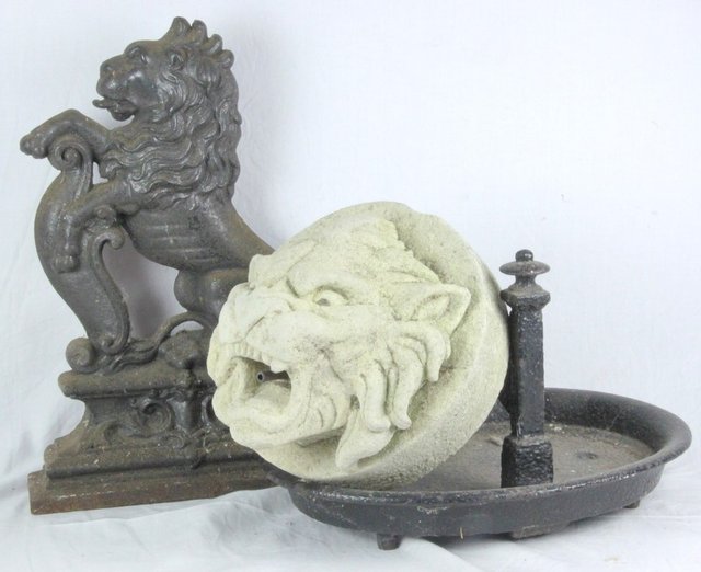 A cast iron door porter 39cm