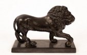 A cast iron figure of a lion,