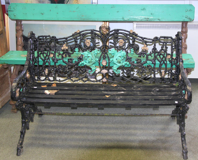 A cast iron garden bench with