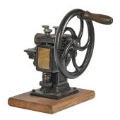 A cast iron hand cranked leath