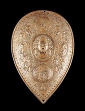 A CAST IRON SHIELD AFTER BENVE