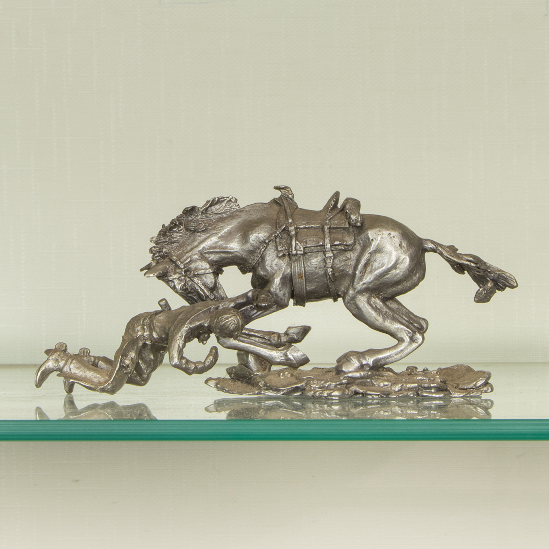 A CAST METAL EQUESTRIAN GROUP OF