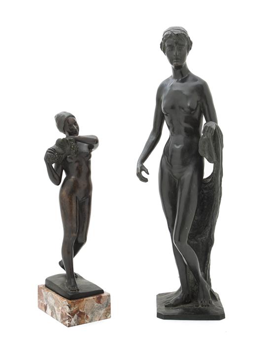A Cast Metal Figure of a Woman