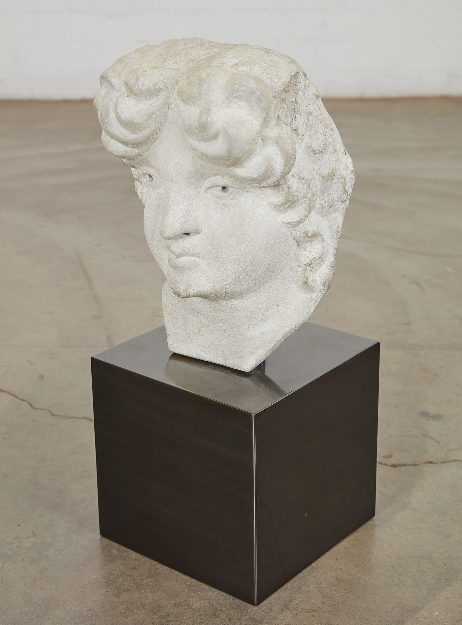 A CAST STONE BUSTA cast stone