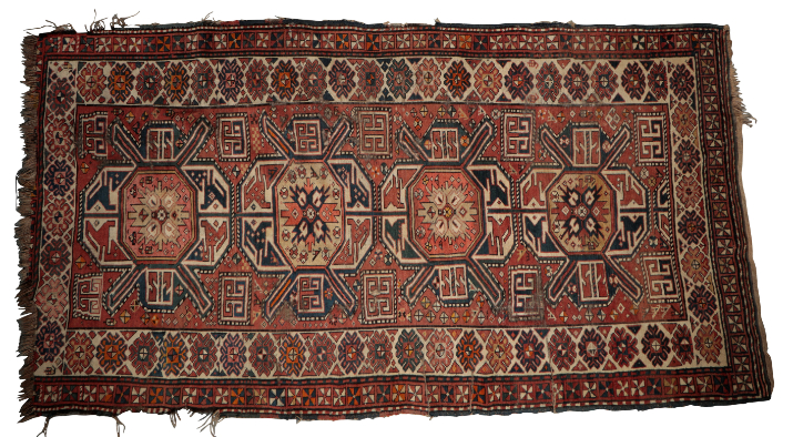 A CAUCASIAN RUG the brick-red