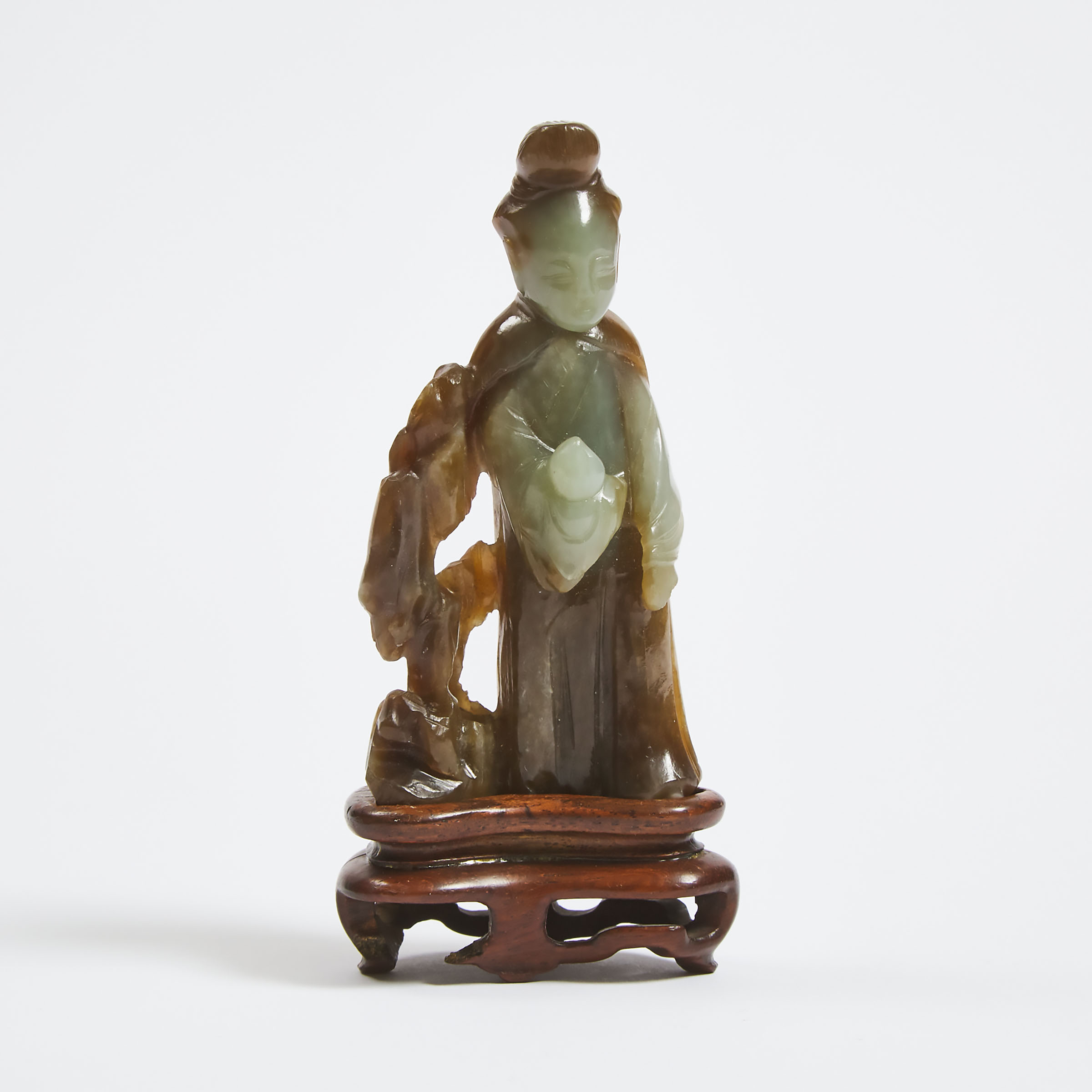 A Celadon and Russet Jade Figure of