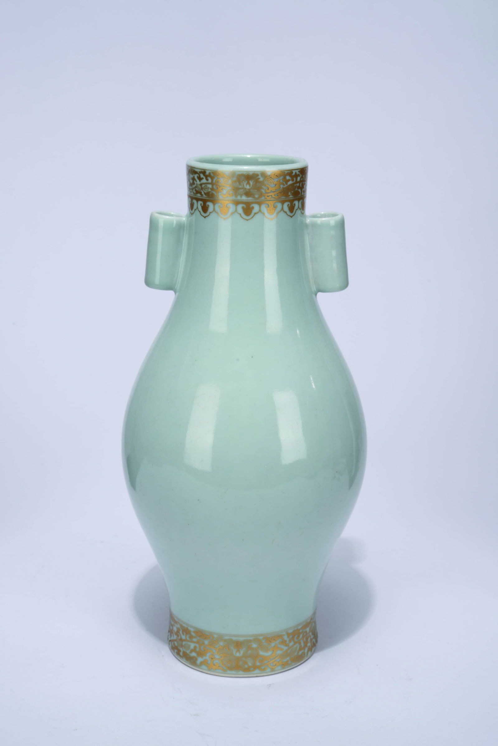 A CELADON-GLAZED GILT-DECORATED