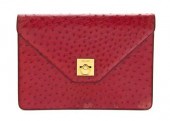 A Celine Red Ostrich Clutch go