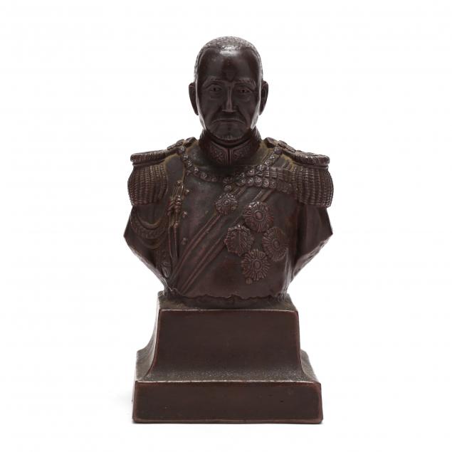 A CERAMIC BUST OF A JAPANESE