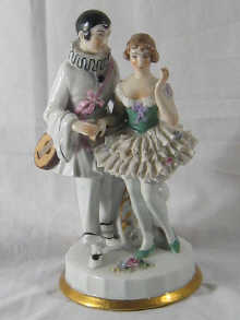 A ceramic group of a troubadour and