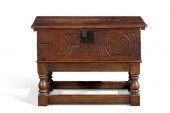 A CHARLES II CARVED OAK BIBLE