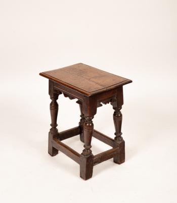 A Charles II oak joint stool,