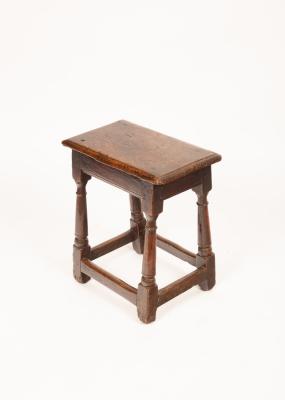 A Charles II oak jointed stool, the