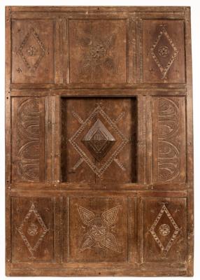 A Charles II panelled oak bed