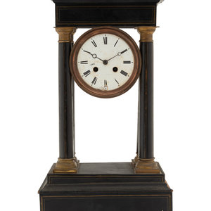 A Charles X Ebonized Mantel Clock