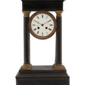 A Charles X Ebonized Mantel Cl