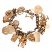 A CHARM BRACELET WITH 25 GOLD