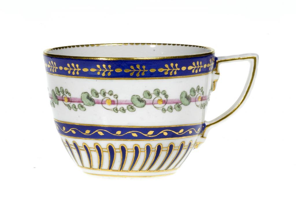 A CHELSEA-DERBY TEACUP enamelled in