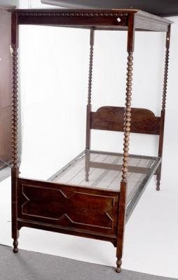 A child's four poster bed with